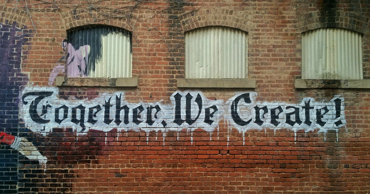 Together We Create Graffiti Red Brick Wall - ESEO